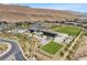 An aerial view shows community amenities including a pool, clubhouse, and landscaped green spaces at 5166 Stone View Dr, Las Vegas, NV 89135