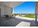 Enjoy this covered back patio with outdoor seating, artificial turf and a fire pit at 5166 Stone View Dr, Las Vegas, NV 89135