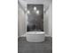 Modern bathroom featuring a freestanding tub with sleek tile accent wall and recessed lighting at 5166 Stone View Dr, Las Vegas, NV 89135