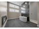 Spa-like bathroom showcasing a soaking tub, sleek tiles, and a modern fireplace feature at 5166 Stone View Dr, Las Vegas, NV 89135