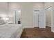 Bright bedroom with hardwood floors and ensuite access, featuring great natural light at 5166 Stone View Dr, Las Vegas, NV 89135