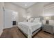 Stylish bedroom with an ensuite bathroom, bright lighting, and hardwood floors at 5166 Stone View Dr, Las Vegas, NV 89135