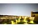 Expansive city view from backyard featuring a landscaped yard with tasteful lighting at 5166 Stone View Dr, Las Vegas, NV 89135