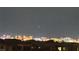Enjoy breathtaking city skyline views from this property, showcasing the vibrant lights of the city at night at 5166 Stone View Dr, Las Vegas, NV 89135