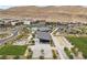 Aerial view of neighborhood park with pool, bocce ball court, and community center at 5166 Stone View Dr, Las Vegas, NV 89135