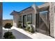 The courtyard has a gated entrance, manicured landscaping, and leads to the front door at 5166 Stone View Dr, Las Vegas, NV 89135