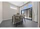 A chic dining area boasts a breakfast bar, counter seating, and views of the outdoor patio at 5166 Stone View Dr, Las Vegas, NV 89135