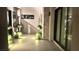 Modern style entryway with tile flooring, desert landscaping, and black window and door frames at 5166 Stone View Dr, Las Vegas, NV 89135