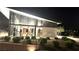 Well-lit fitness center at night with modern exercise equipment and glass windows, surrounded by landscaping at 5166 Stone View Dr, Las Vegas, NV 89135