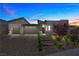 Charming one-story home with a stone driveway, manicured landscaping, and a modern design at 5166 Stone View Dr, Las Vegas, NV 89135