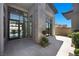 Striking front entry with stone accents, modern windows and door, and minimalist landscaping at 5166 Stone View Dr, Las Vegas, NV 89135