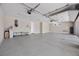 Bright and spacious garage with epoxy flooring, plenty of room for storage, and ample lighting at 5166 Stone View Dr, Las Vegas, NV 89135