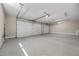 Spacious garage with a clean epoxy floor and two large doors for easy parking and storage at 5166 Stone View Dr, Las Vegas, NV 89135
