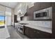 Contemporary kitchen featuring stainless steel appliances, designer backsplash, and sleek cabinetry at 5166 Stone View Dr, Las Vegas, NV 89135