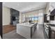 Open concept kitchen with a large island, stainless appliances, and seamless flow to the living area at 5166 Stone View Dr, Las Vegas, NV 89135
