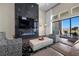 Contemporary living room featuring sleek fireplace, flatscreen TV, and stylish decor at 5166 Stone View Dr, Las Vegas, NV 89135