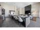 Open floor plan living area with modern fireplace, flat screen television, and dining table at 5166 Stone View Dr, Las Vegas, NV 89135