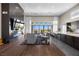 Bright living area with fireplace, modern decor, hardwood flooring, and access to a back patio at 5166 Stone View Dr, Las Vegas, NV 89135