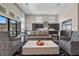 Bright living room area with high ceilings, modern furniture, and open floorplan to the kitchen at 5166 Stone View Dr, Las Vegas, NV 89135