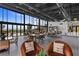 Expansive lounge area with floor-to-ceiling windows, modern furnishings, and abundant natural light at 5166 Stone View Dr, Las Vegas, NV 89135
