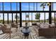 Stylish lounge area with comfortable seating and panoramic views through large windows at 5166 Stone View Dr, Las Vegas, NV 89135