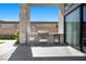 Built-in stainless steel outdoor kitchen with BBQ, mini-fridge, and ample counter space for entertaining at 5166 Stone View Dr, Las Vegas, NV 89135