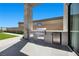 Outdoor kitchen with a stainless steel grill, mini fridge, and countertop space at 5166 Stone View Dr, Las Vegas, NV 89135