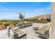 Comfortable outdoor seating area on a patio, offering desert landscape views at 5166 Stone View Dr, Las Vegas, NV 89135