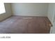 Spacious carpeted bedroom with a window offering natural light at 5308 La Quinta Hills St, North Las Vegas, NV 89081