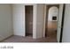 Bedroom showcasing a closet with sliding doors and an open doorway to the living room at 5308 La Quinta Hills St, North Las Vegas, NV 89081