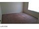 Bedroom with a window, carpet flooring and neutral color walls at 5308 La Quinta Hills St, North Las Vegas, NV 89081