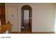 Hallway featuring tile flooring and an arched doorway that adds an elegant touch at 5308 La Quinta Hills St, North Las Vegas, NV 89081
