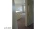 View of the upstairs hallway leading to carpeted bedrooms and a bathroom at 5308 La Quinta Hills St, North Las Vegas, NV 89081