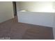 Upstairs hallway featuring neutral colored walls and carpet flooring at 5308 La Quinta Hills St, North Las Vegas, NV 89081