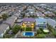Aerial view of suburban homes with well manicured lawns, streets, and in-ground pools in backyards at 5480 Oatfield St, North Las Vegas, NV 89081