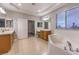 Bathroom with double sinks, soaking tub, and walk-in closet at 5480 Oatfield St, North Las Vegas, NV 89081