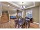 Dining area overlooking the living room and entryway and staircase at 5480 Oatfield St, North Las Vegas, NV 89081