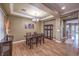 Dining area features wood floors, decorative chandelier, and stylish dining set at 5480 Oatfield St, North Las Vegas, NV 89081