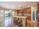 Kitchen featuring an island with seating and stainless steel appliances at 5480 Oatfield St, North Las Vegas, NV 89081