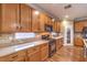 Modern kitchen features stainless steel appliances and granite countertops at 5480 Oatfield St, North Las Vegas, NV 89081