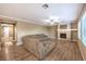 Spacious living room featuring hardwood floors, a fireplace, and plenty of natural light at 5480 Oatfield St, North Las Vegas, NV 89081