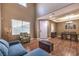Open-concept living area with wood floors, natural light, and stylish furniture at 5480 Oatfield St, North Las Vegas, NV 89081