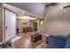Open-concept living area with stairs, dining area, and door to outside at 5480 Oatfield St, North Las Vegas, NV 89081