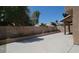 Backyard featuring mature landscaping and a block wall at 5509 Big Sky Ln, Las Vegas, NV 89149