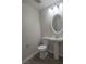 Half bathroom featuring new vanity, mirror and toilet at 5509 Big Sky Ln, Las Vegas, NV 89149