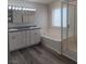 Bathroom featuring a bathtub, shower and double vanity sink with granite countertops at 5509 Big Sky Ln, Las Vegas, NV 89149