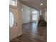 Inviting entryway featuring new light wood flooring, high ceilings and stairway at 5509 Big Sky Ln, Las Vegas, NV 89149