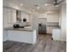 Modern kitchen with new white cabinets, granite countertops, and stainless steel appliances at 5509 Big Sky Ln, Las Vegas, NV 89149