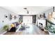 Bright living room features hardwood floors, fireplace and chic decor at 5817 Rae Dr, Las Vegas, NV 89108