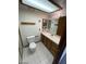 Bathroom with white tile floors, a vanity, and a shower with glass door at 600 Woodmount Dr, Las Vegas, NV 89107